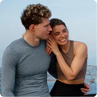 Happy couple by water.