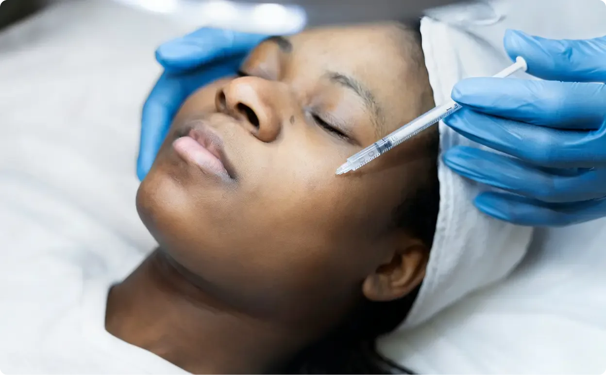 Female patient getting regenerative injection on face.