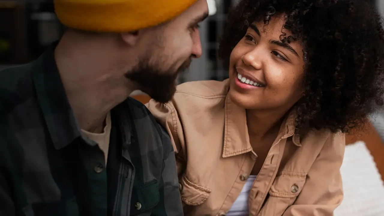 Smiling couple sharing a warm moment together.